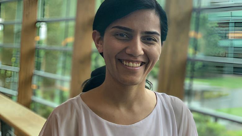 woman smiling with hair in a ponytail 